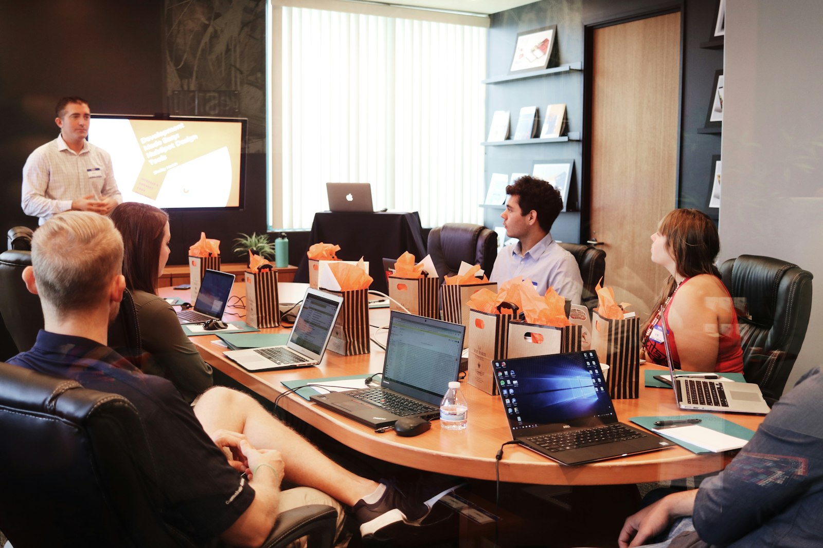 Executive team in conference room reviewing incident response communications plan
