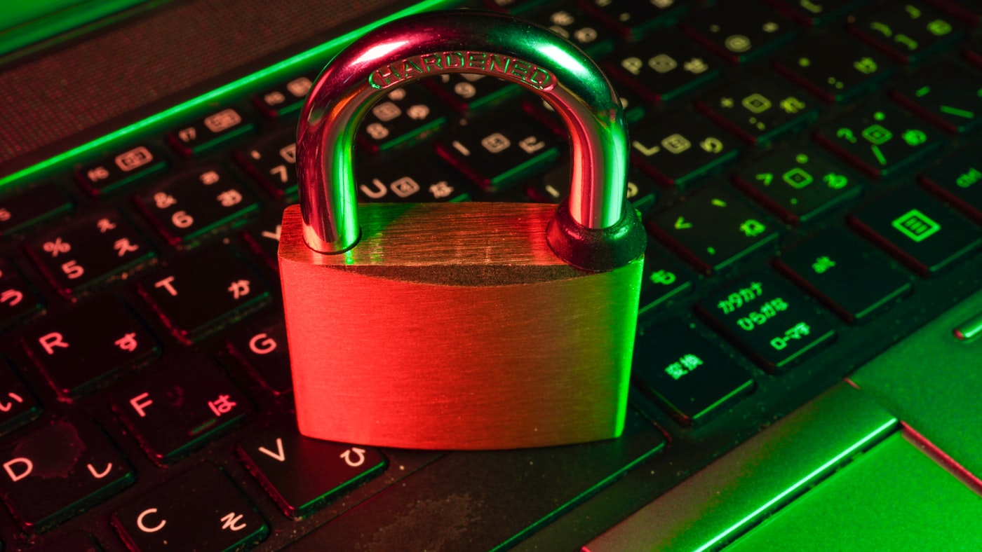 Cybersecurity lock and digital data visualization representing carrier external scans before binding