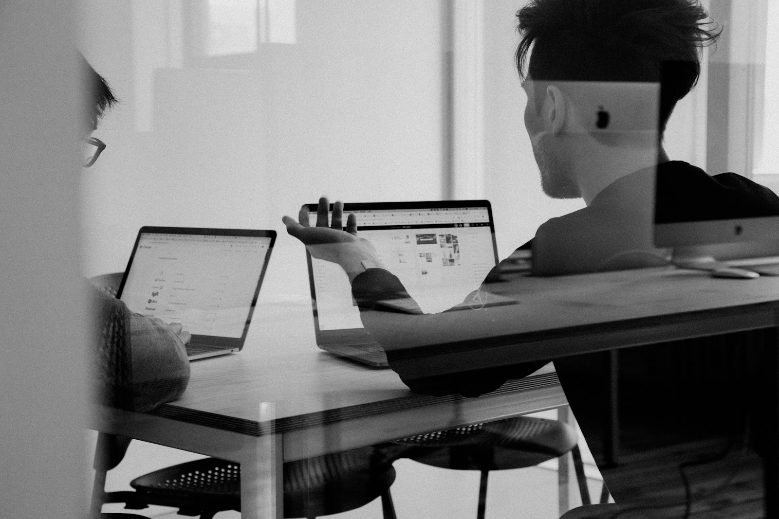 Helpdesk technician supporting business customer over headset