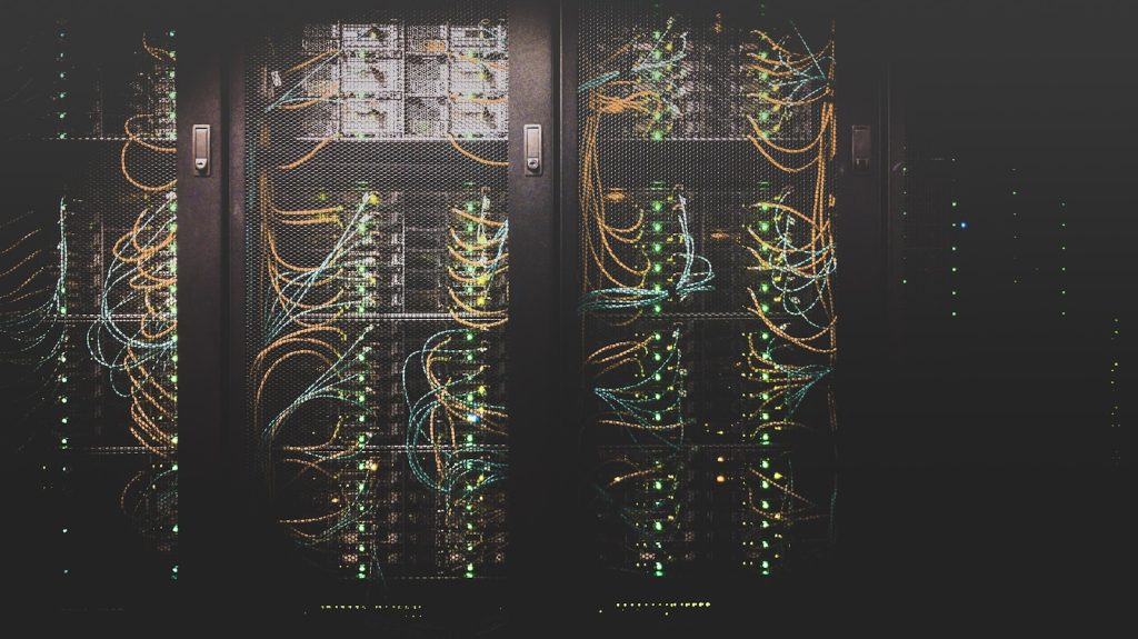 Cloud icon over server racks representing cloud storage