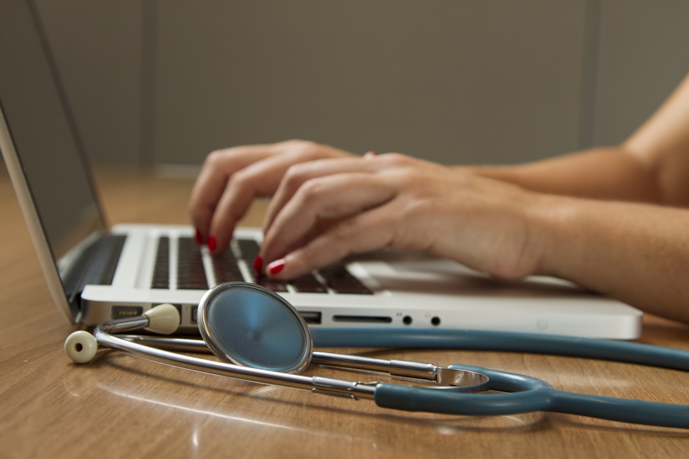 Medical professional with tablet enforcing MFA on EHR access