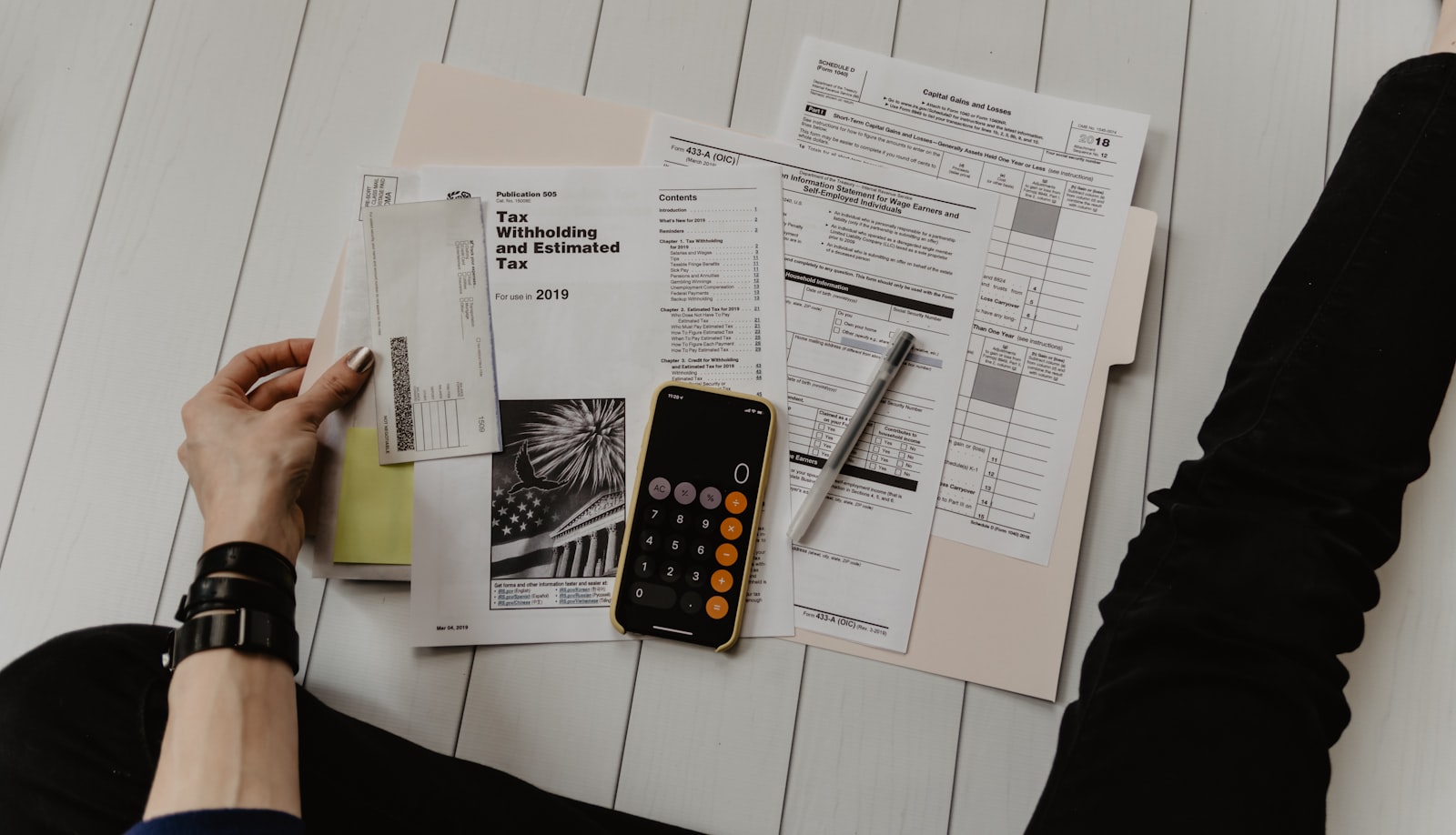 Spreadsheet and financial planning documents on desk