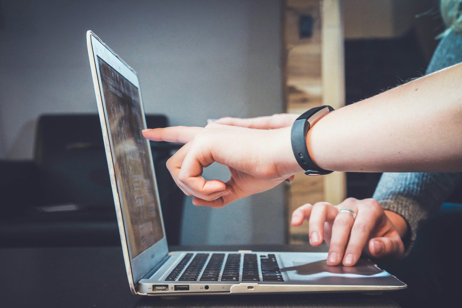 Employee searching IT knowledge base on laptop
