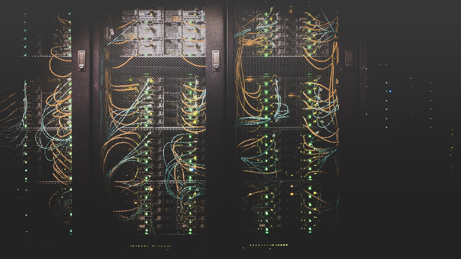 IT technician installing network equipment in server rack