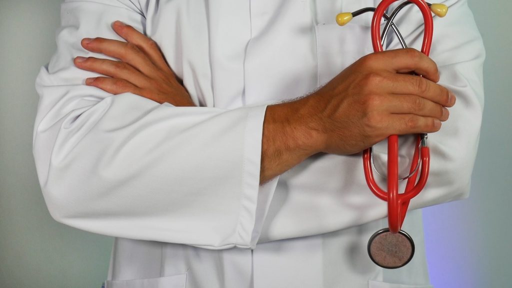 Doctor reviewing patient records on tablet