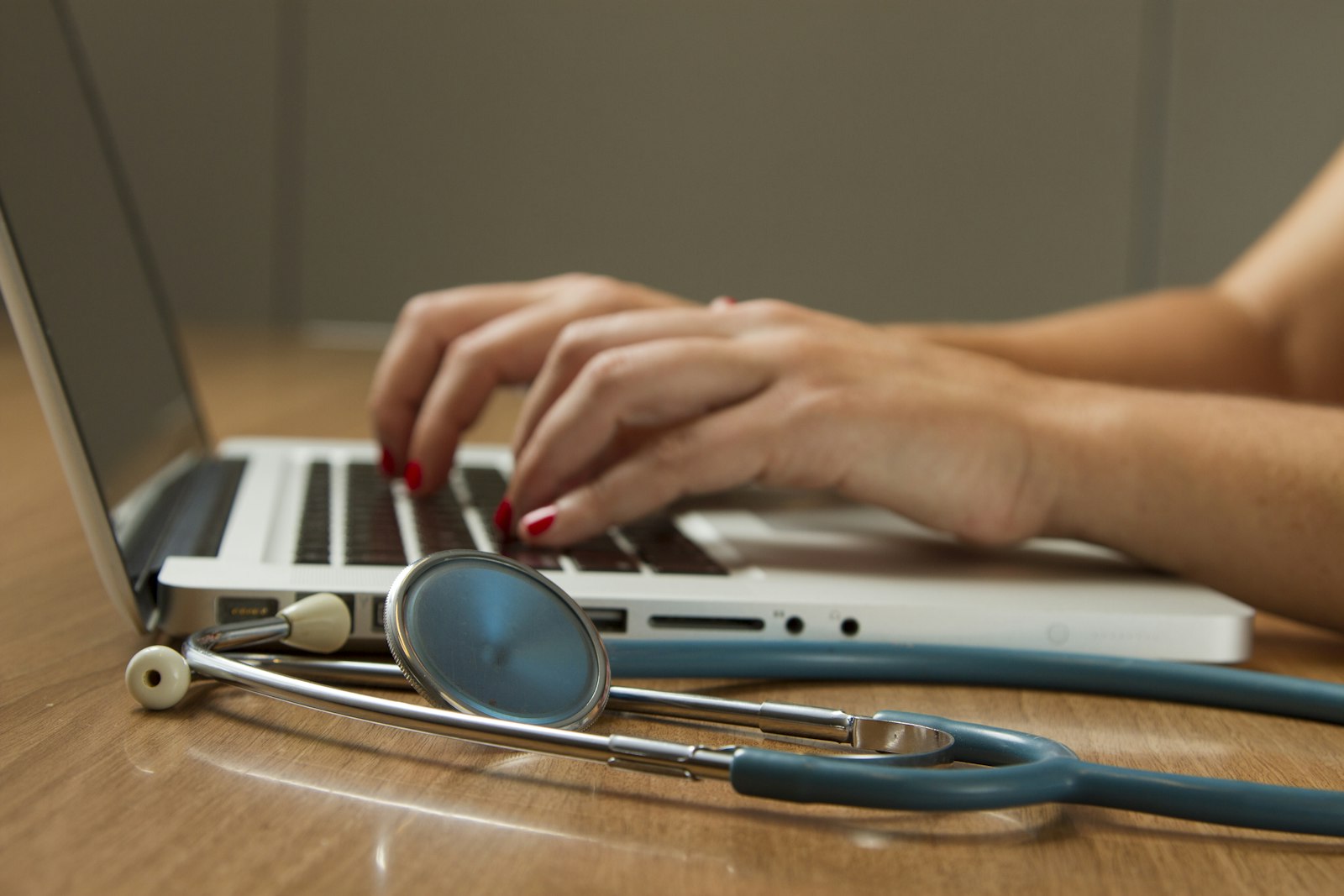Healthcare and legal professionals working with secure technology in an office