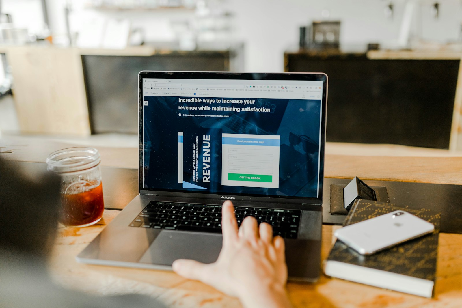 Startup founder reviewing cloud spend dashboard on laptop