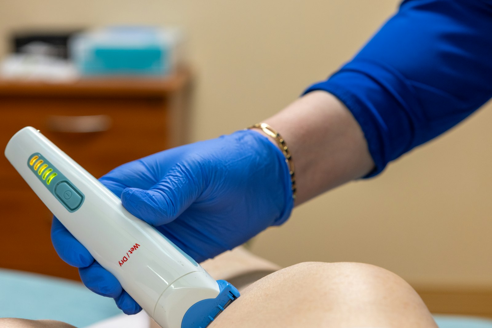 Medical professional using laser device at a medspa clinic